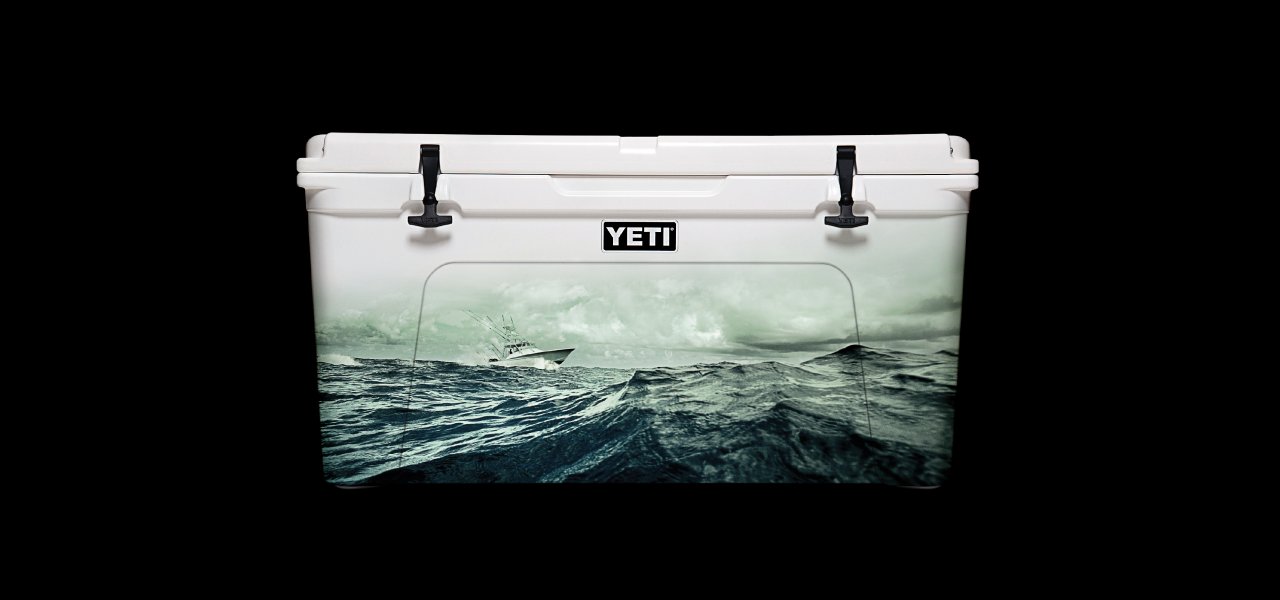 An image of a McGarrah Jessee YETI creative marketing print campaign featuring YETI coolers with different artwork superimposed on their front.