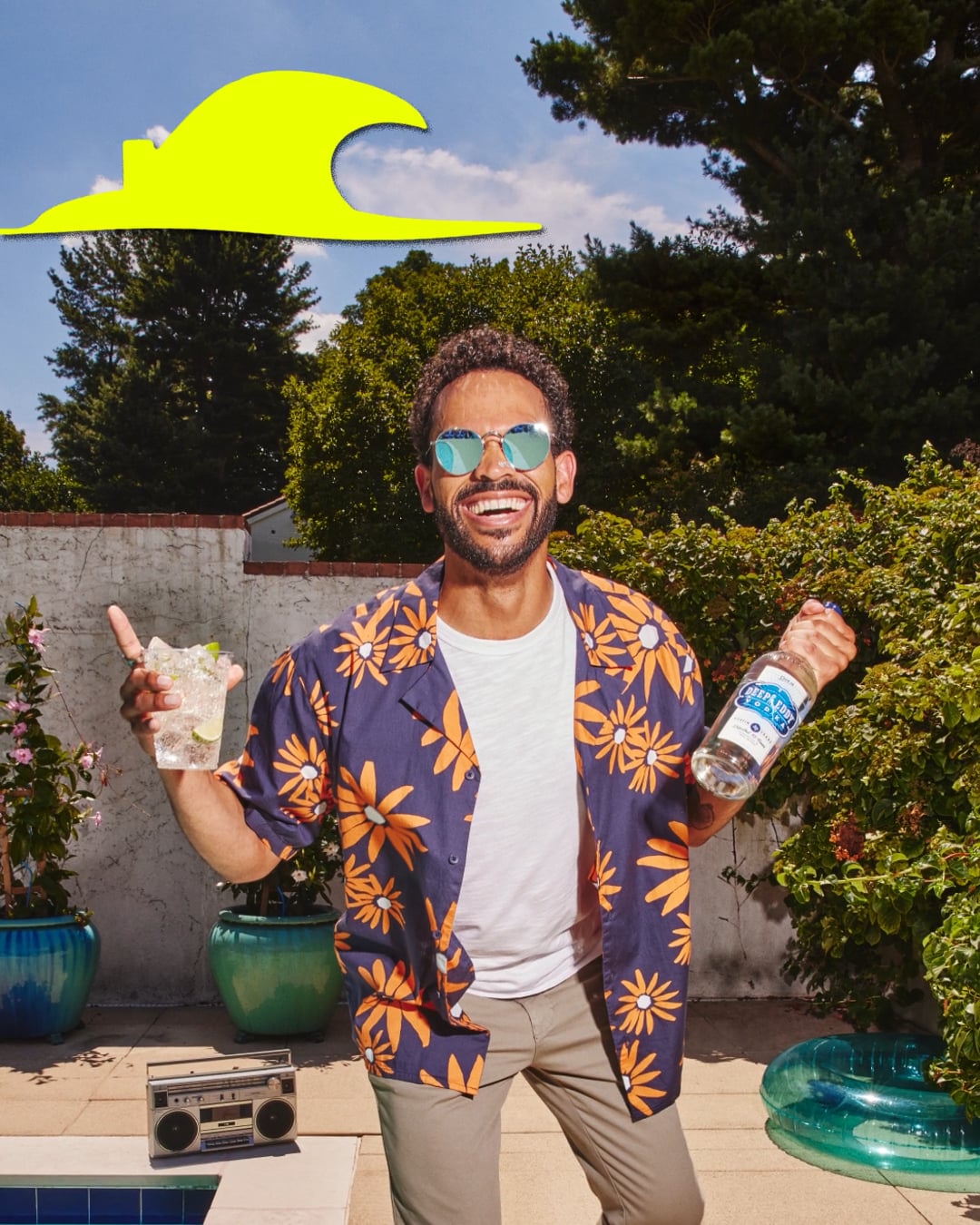 A man standing poolside holding Deep Eddy Vodka, part of the marketing campaign from McGarrah Jessee