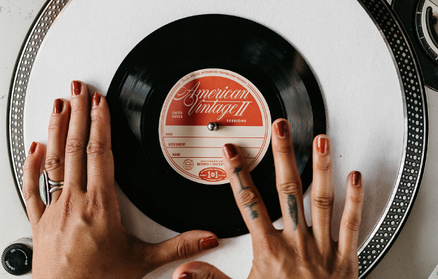 Photograph of a record on a record player. The label reads Fender American Vintage II and was part of the Fender House activation