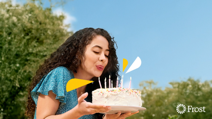 An animated video of a woman blowing out birthday candles