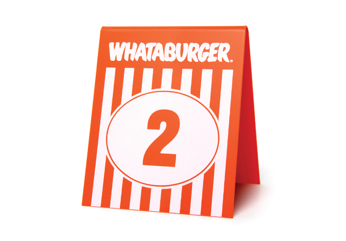 A photograph of a Whataburger table tent design