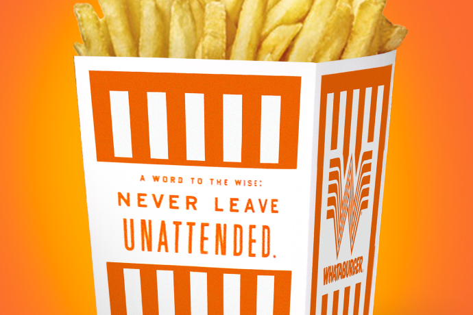 Whataburger packaging design for the fry box that reads "A word to the wise: never leave unattended"