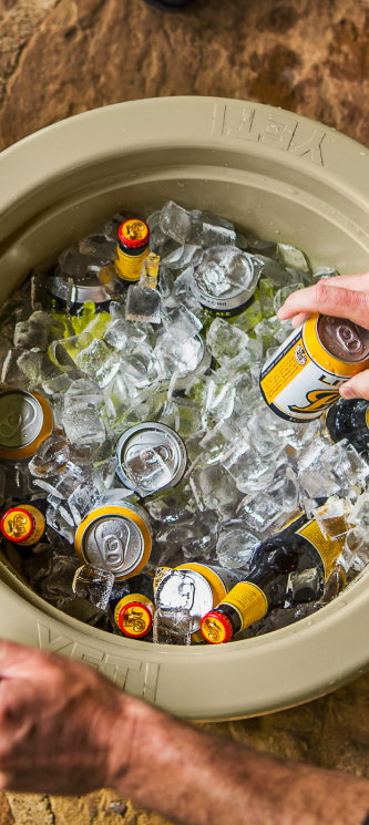 An overhead photograph of the YETI Tank full of beer and ice.