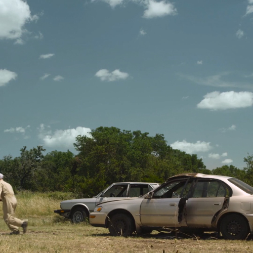 An animated video of a car blowing up and the YETI cooler tumbling away intact.